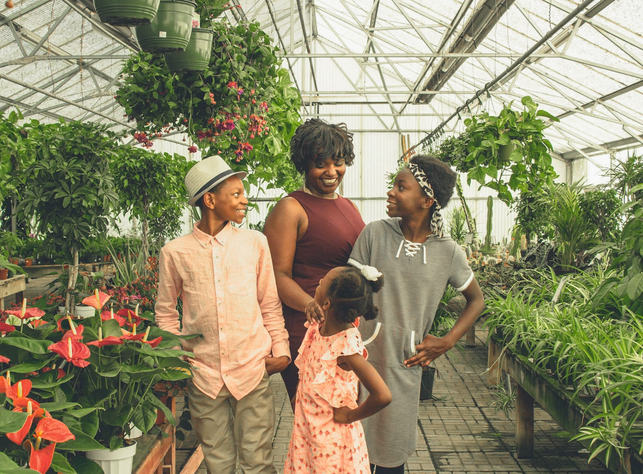 Family in greenhouse.