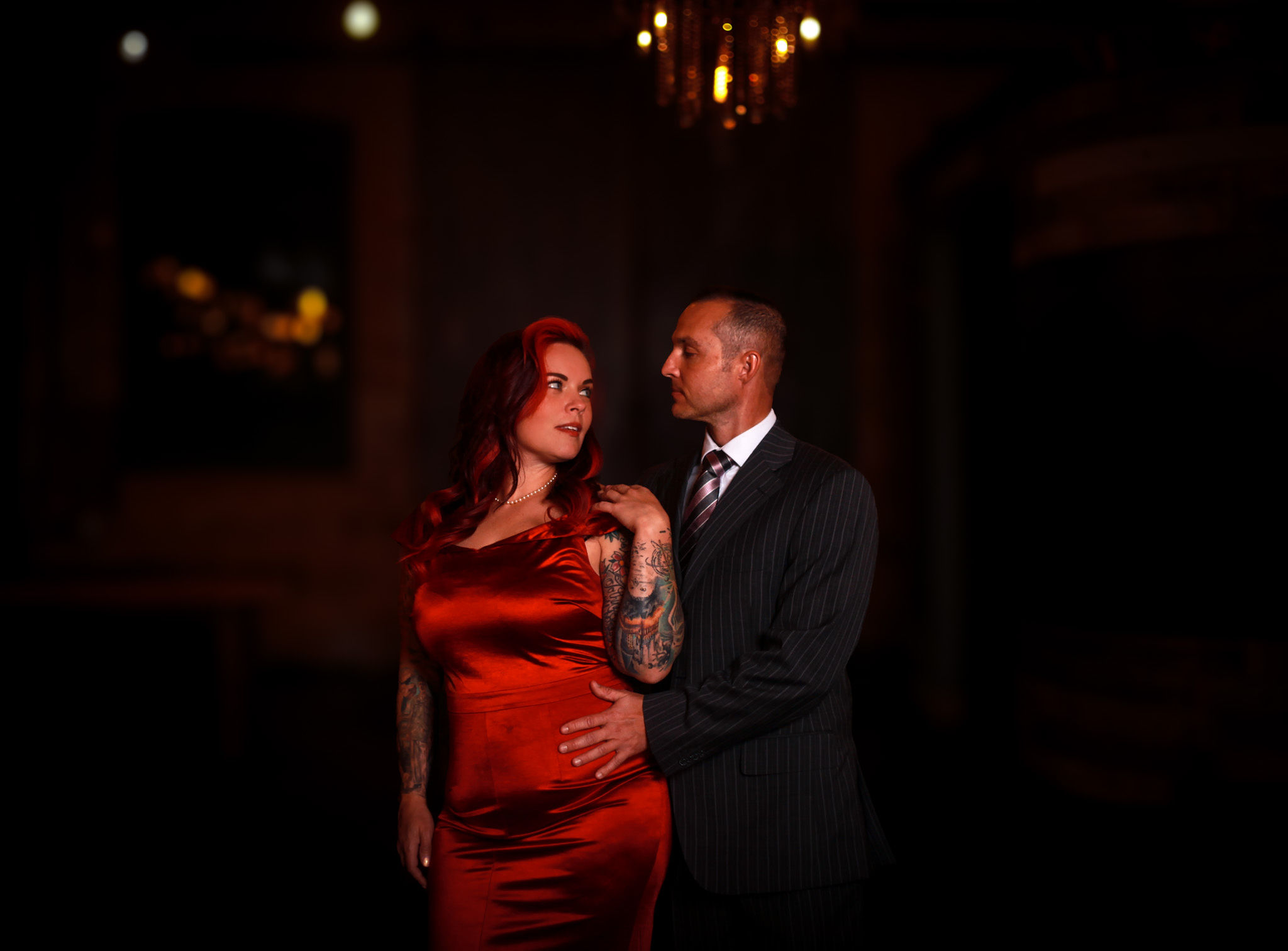 Redhead in red dress.